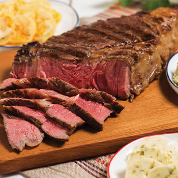Grilled ribeye steak with a trio of compound butters
