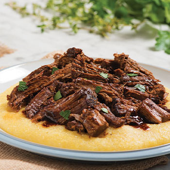 Wine and herb braised beef with creamy polenta